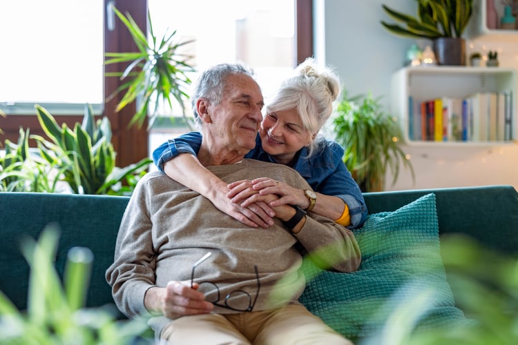 Senior couple at home looking happy
